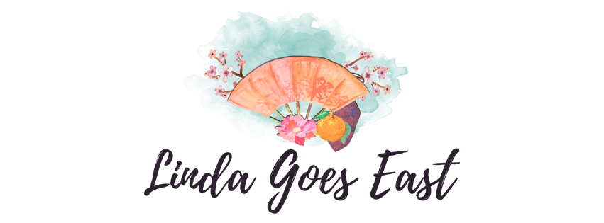 Linda goes East orange fan and sacura blog logo